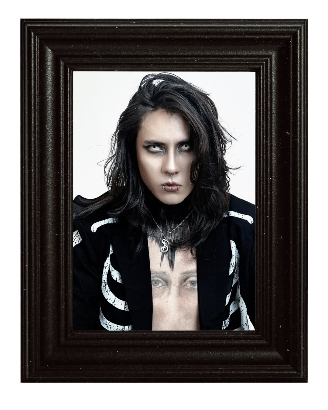 Johan Peraza editorial portrait presented inside a classic dark wooden picture frame