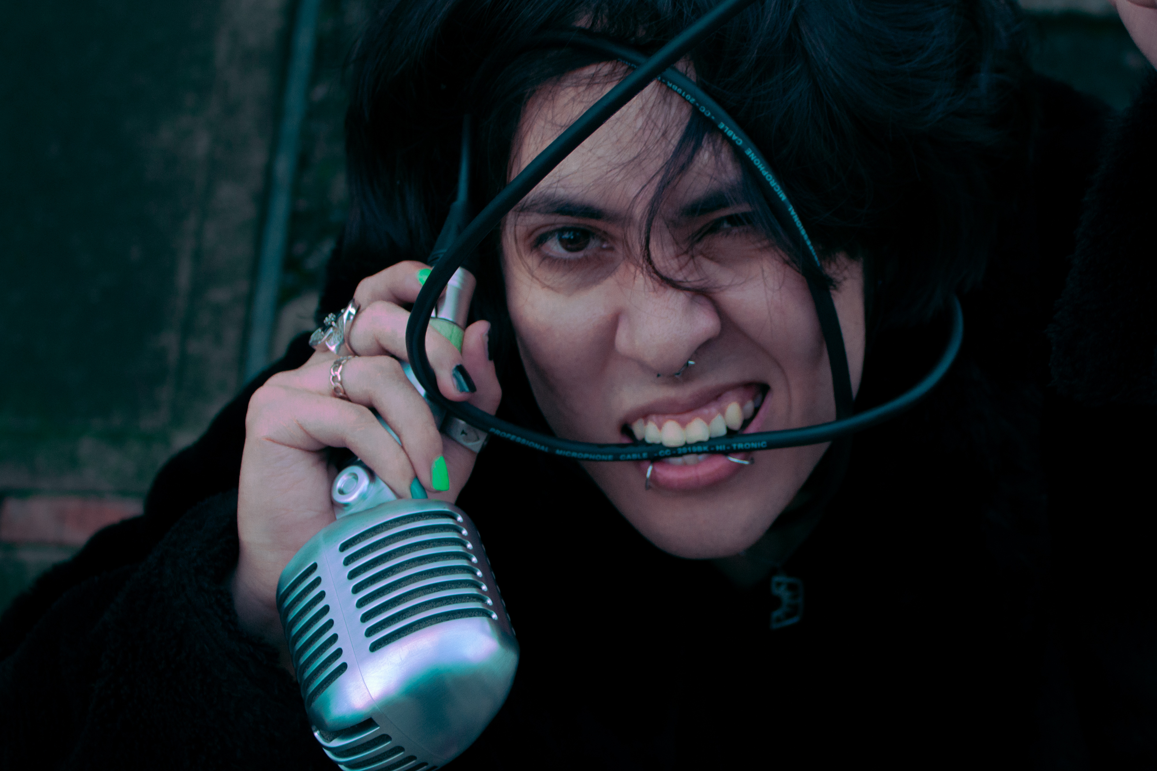 Johan Peraza, expressive close-up vocal performance portrait with a shure super 55 studio microphone