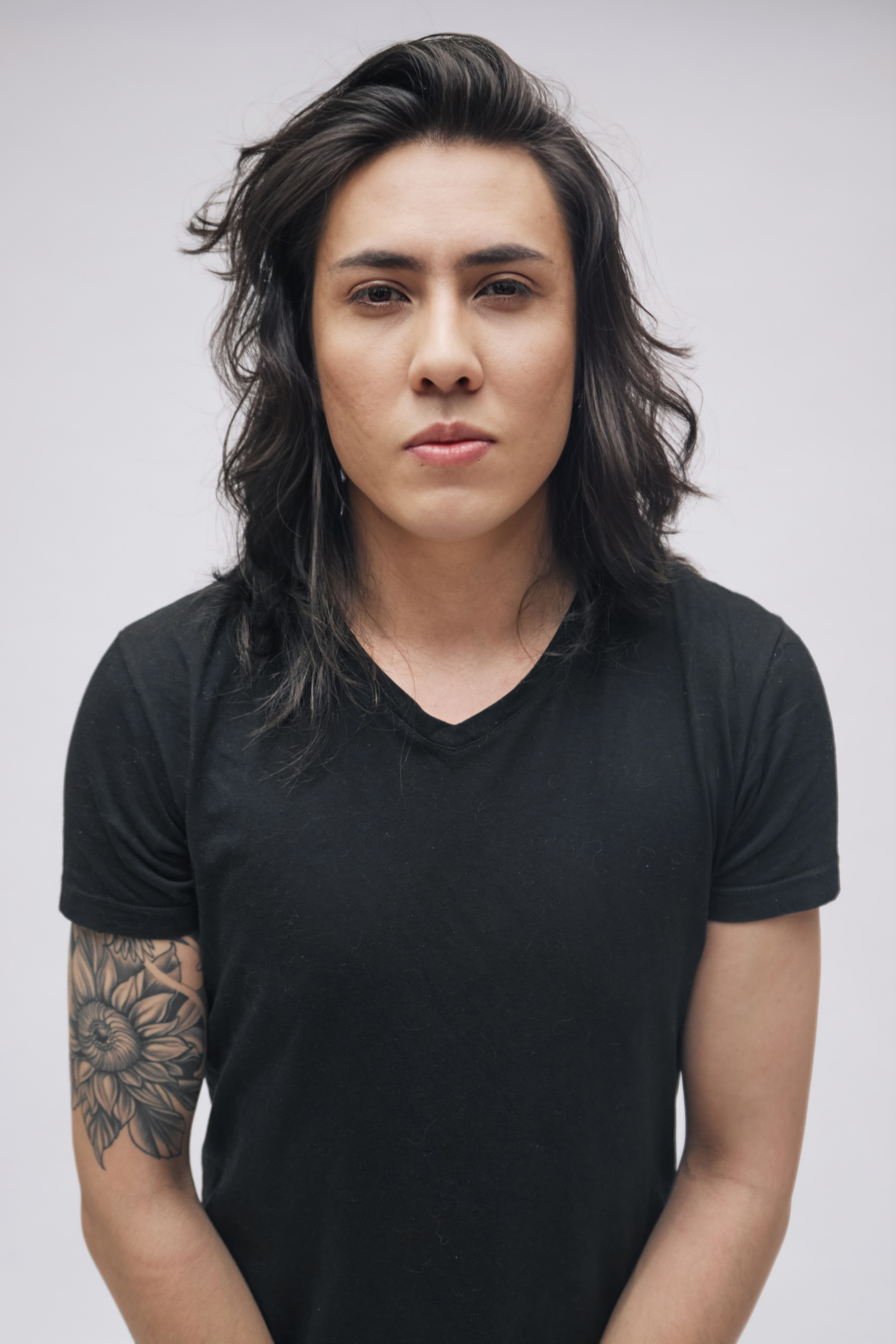 Johan Peraza, official agency polaroid headshot in a black t-shirt against a clean studio background