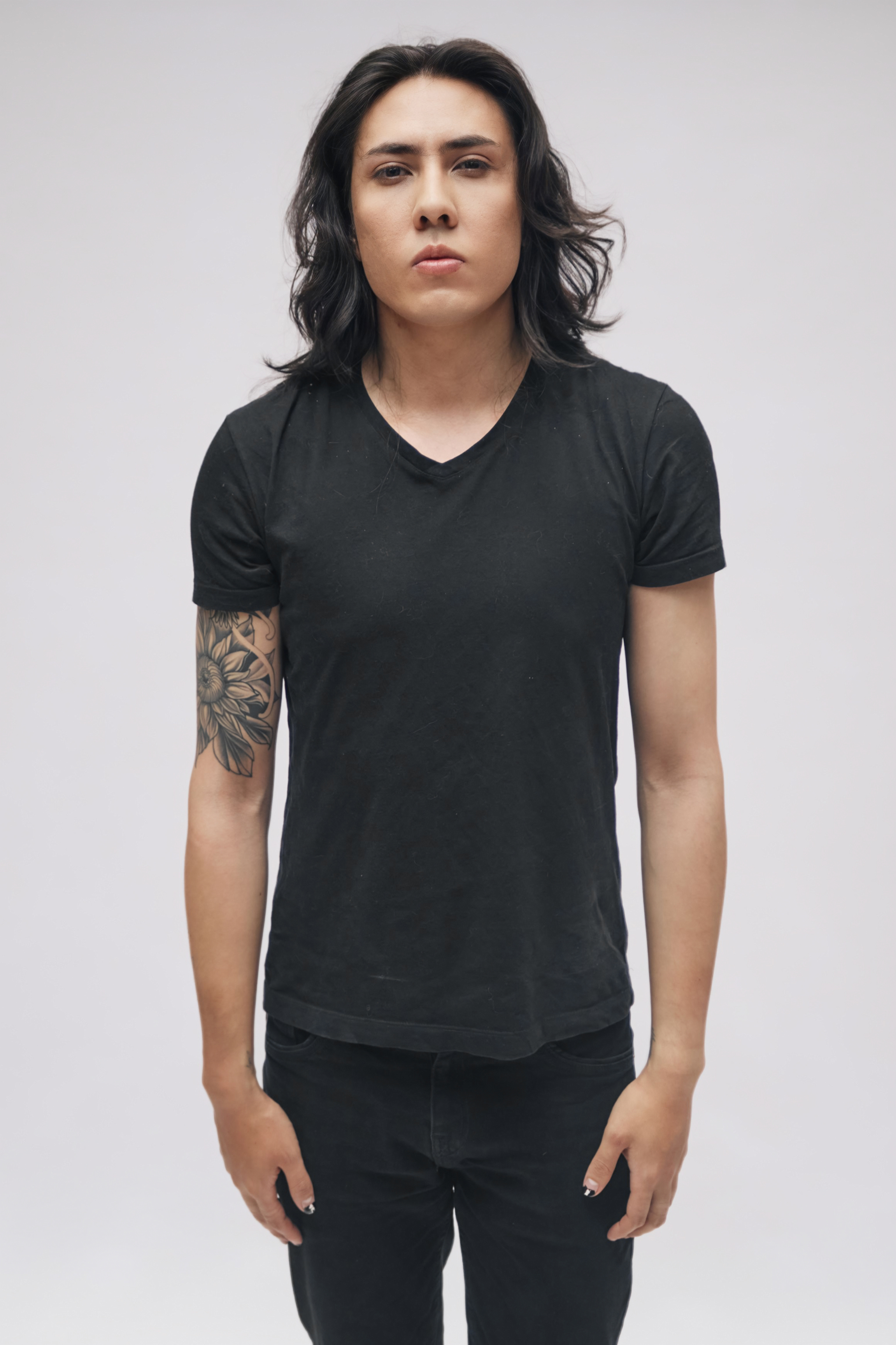 Johan Peraza, model digital portfolio portrait showcasing arm tattoos and exact facial features